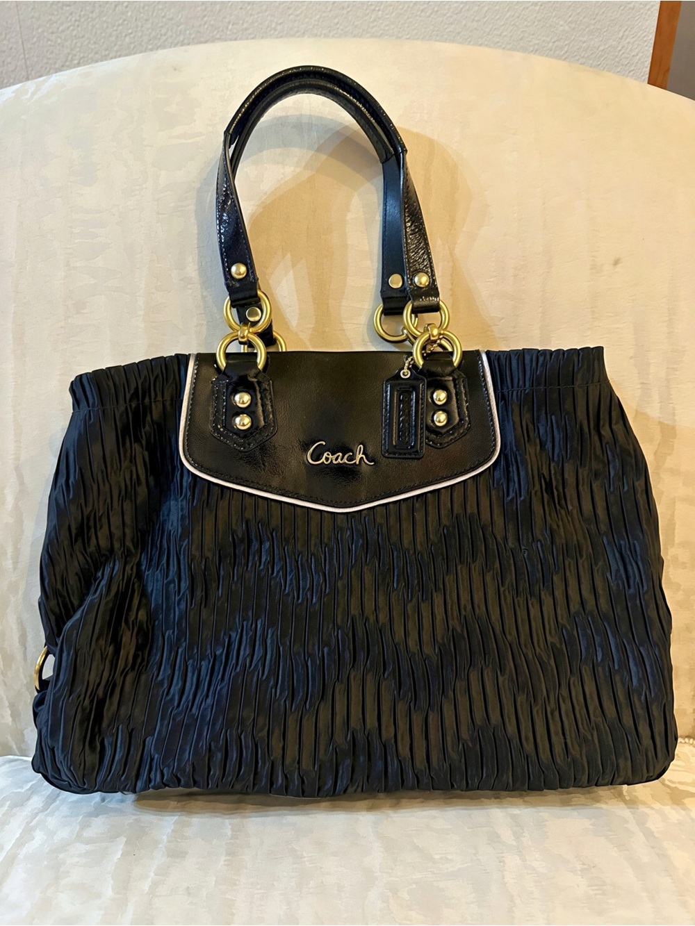 The Coach Ashley Black Pleated Shoulder bag with Gold Hardware